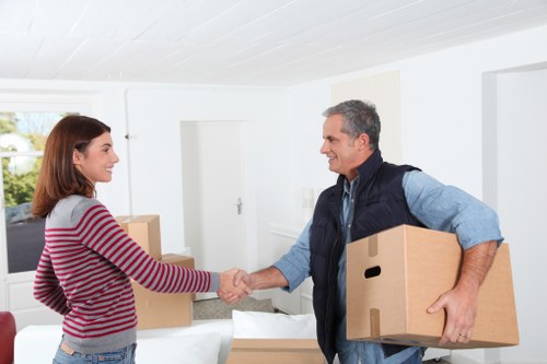 Removal van outside a suburban home during moving day