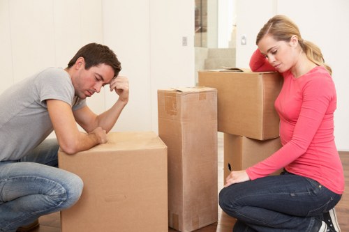 Local moving team transporting furniture and boxes in Merton Park
