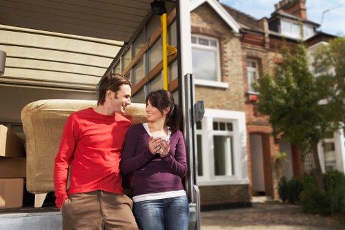 Packed boxes and furniture ready for house removals in a local home